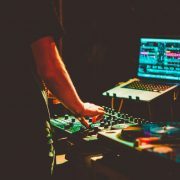 over saturated picture of man working with digital equipment a sound mixer