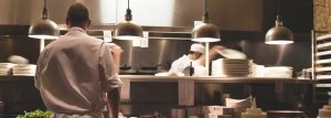 Restaurant kitchen with chef